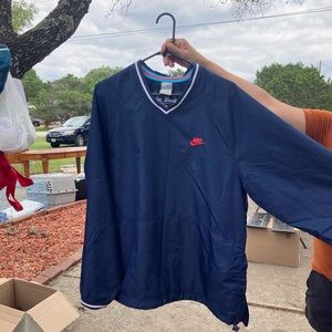 grey tagged nike windbreaker